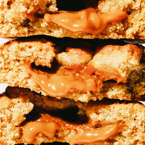 Close-up of a banoffee cookie with banana dough and caramel filling.